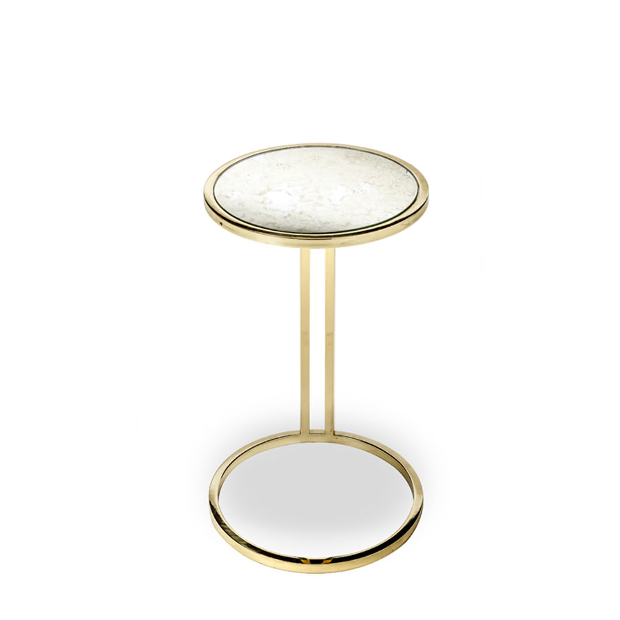 A circular antique mirrored table top complements a polished brass frame for a look that is both high end and high fashion.