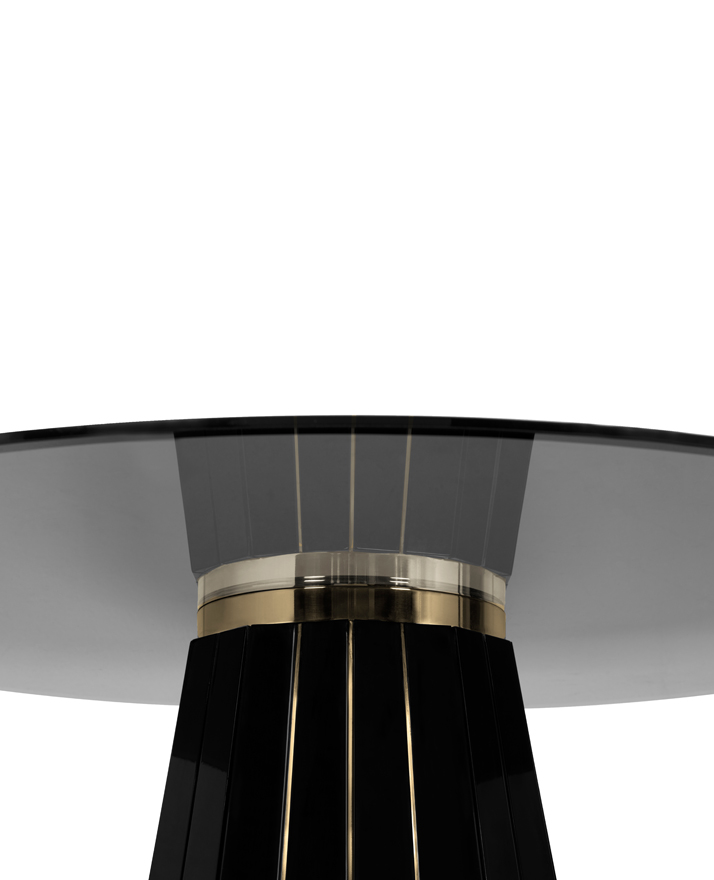 This stunning handcraft table is made of round smoked glass placed on top of a wooden structure in black lacquer touched by gold plated brass bars.