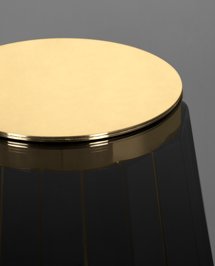 This stunning handcraft table is made of round smoked glass placed on top of a wooden structure in black lacquer touched by gold plated brass bars.